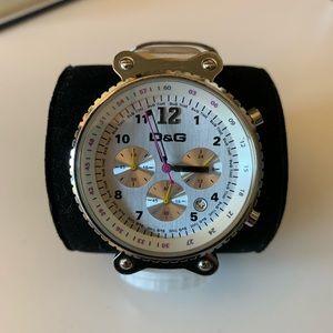 Dolce & Gabbana watch with silver frame and white leather strap.